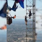 You have to see this! Dramatic video shows two people rescued from tangled hot air balloon over 900 feet in the air