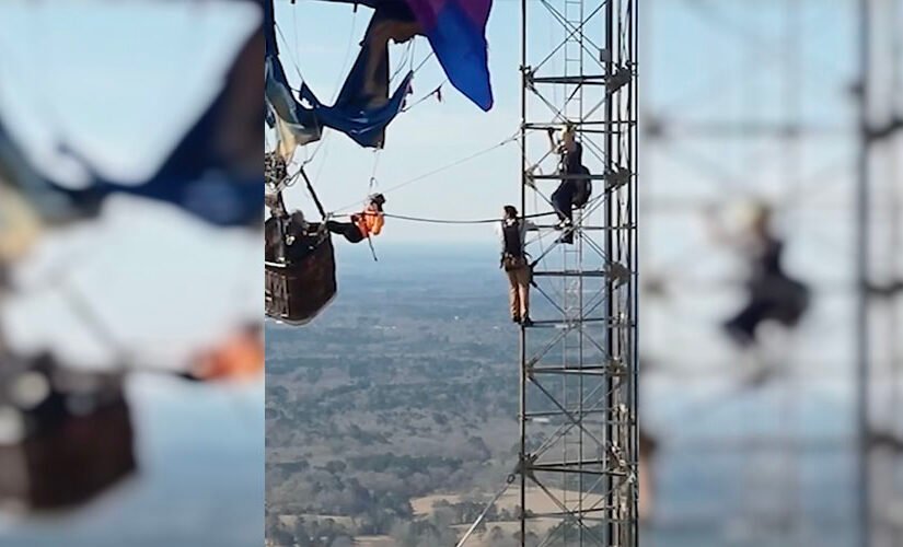 You have to see this! Dramatic video shows two people rescued from tangled hot air balloon over 900 feet in the air
